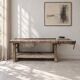 Antique wooden workbench with a vice and drawer.