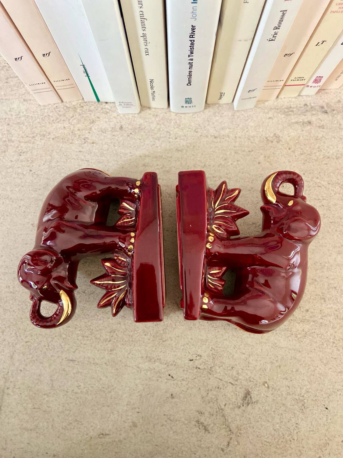 Pair of burgundy ceramic “Elephants” bookends