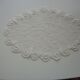 Oval white placemat in crocheted cotton