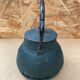 Old green cast iron Japanese teapot with flower decoration + vintage stand