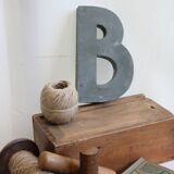 Letter of sign in zinc