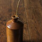 Vintage Bourne Deney stoneware liqueur bottle with pouring spout.
