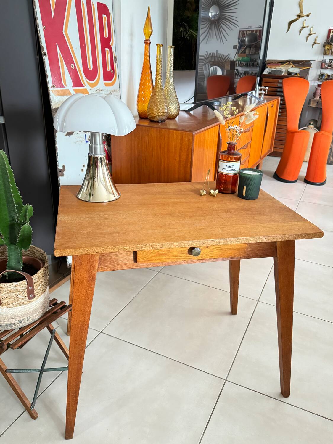 Old wooden desk or side table with compass legs