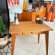 Old wooden desk or side table with compass legs