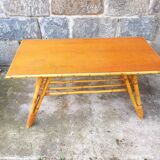 Rattan coffee table with compass legs
