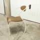 Atypical chair of the 70s metal and wood