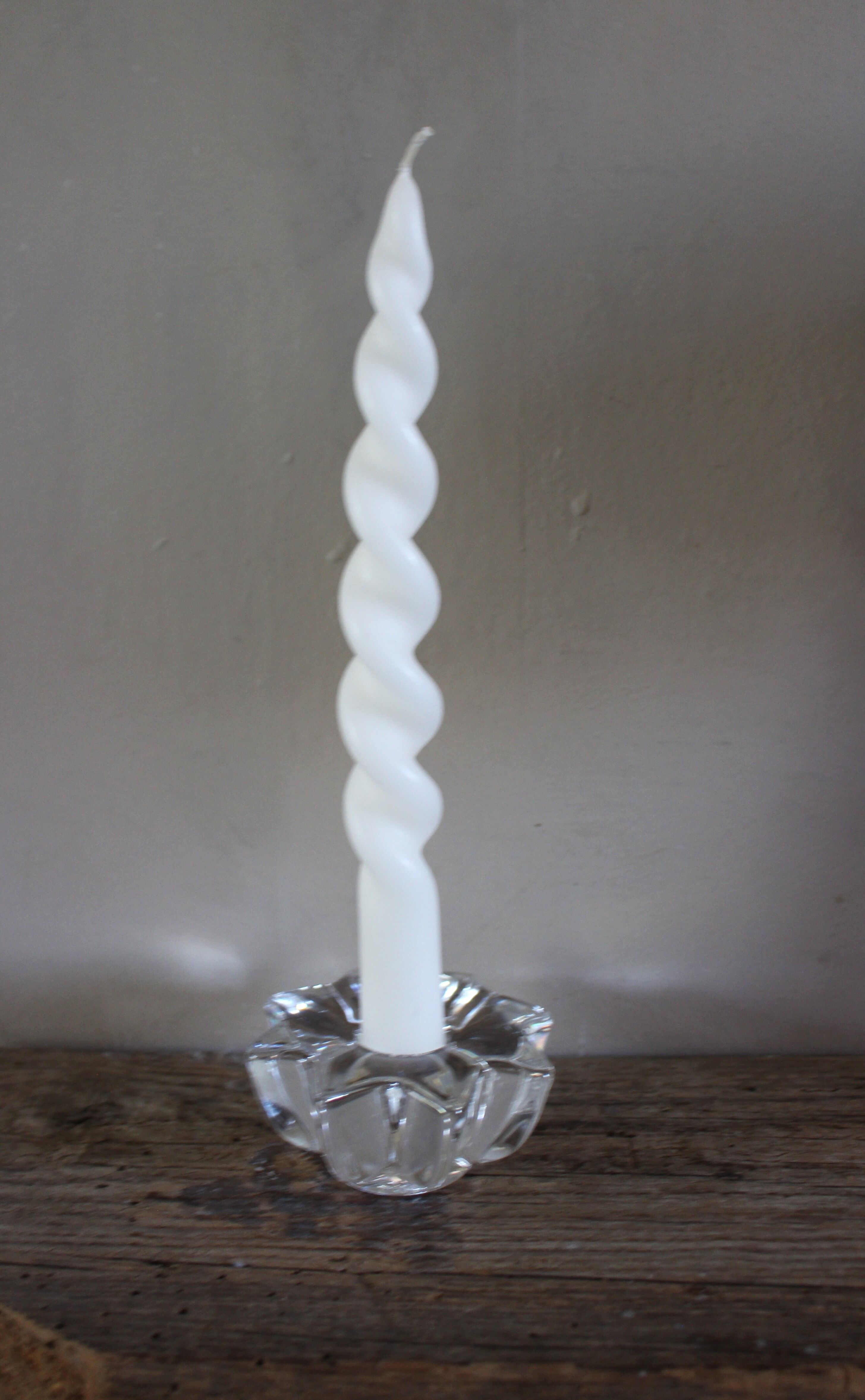 A vintage star flower glass candlestick.