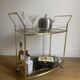 Vintage rolling service in gilded metal and smoked glass