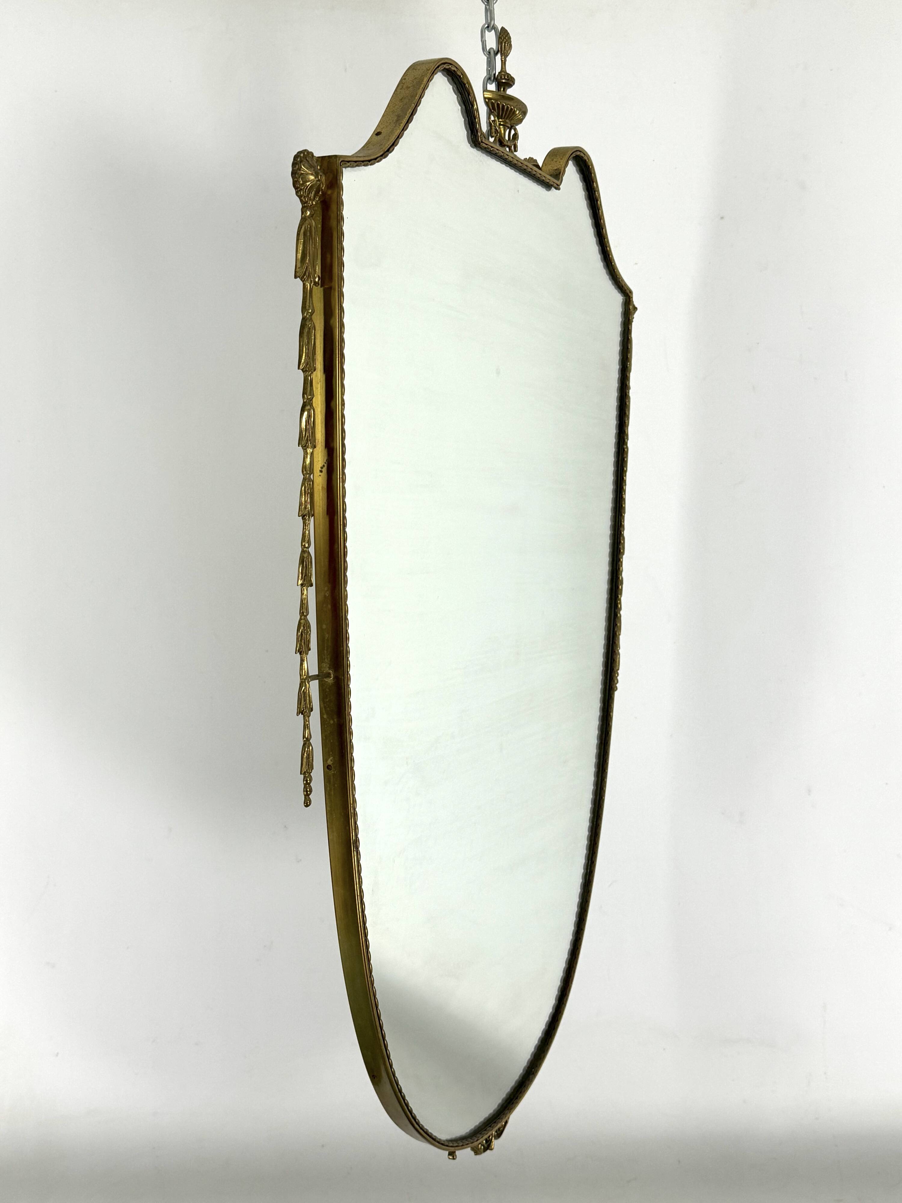 Mid-century Italian mirror in brass. Italy 1950s