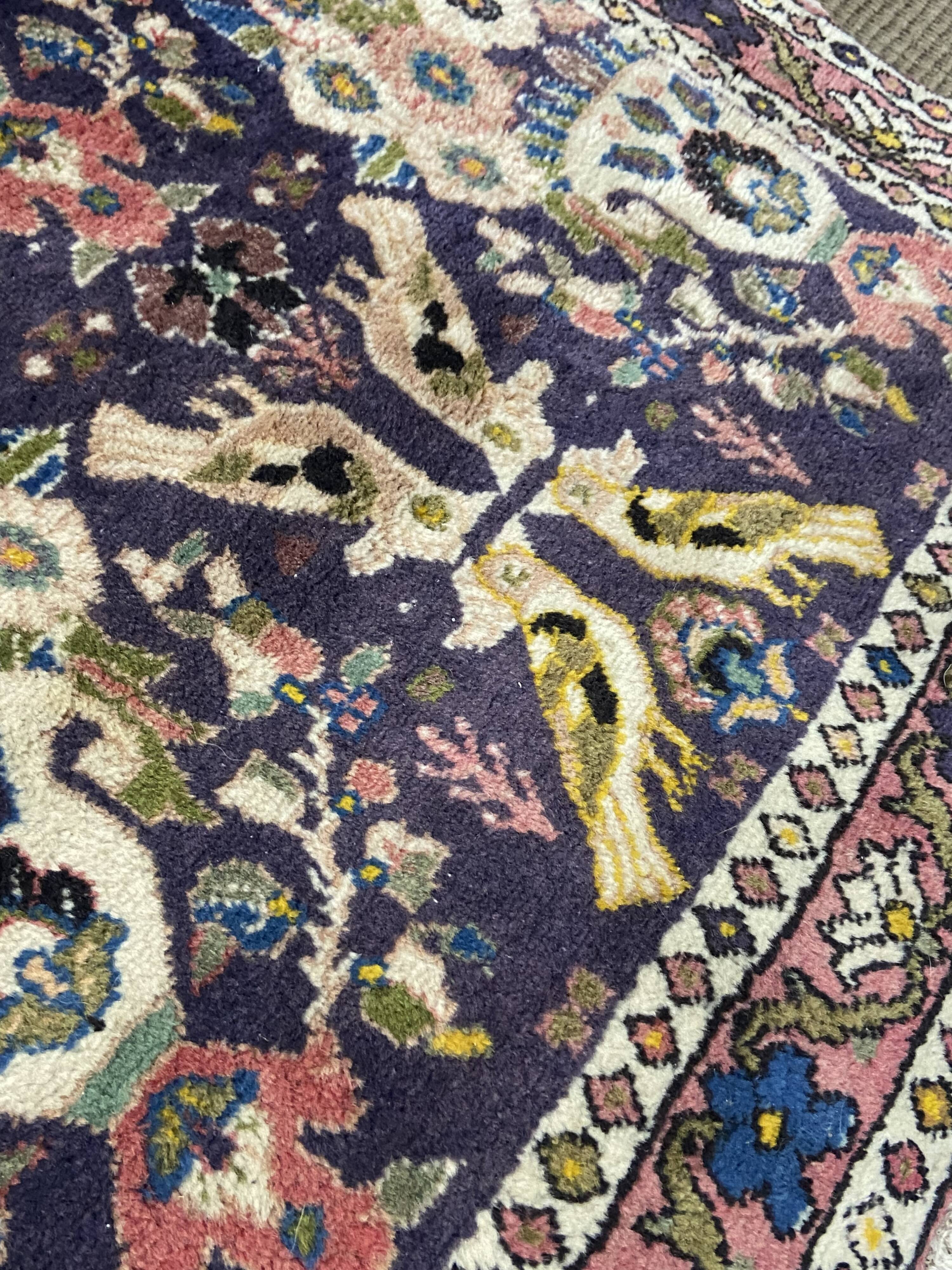 Antique Oriental rug from a nomadic tribe, 1950-1980, birds on a purple background