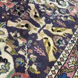 Antique Oriental rug from a nomadic tribe, 1950-1980, birds on a purple background