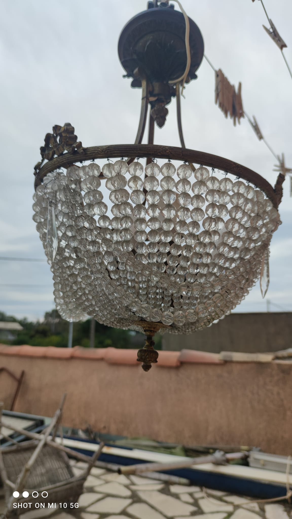 Antique bronze and crystal chandelier, formerly gas-powered, dating from the late 19th century.