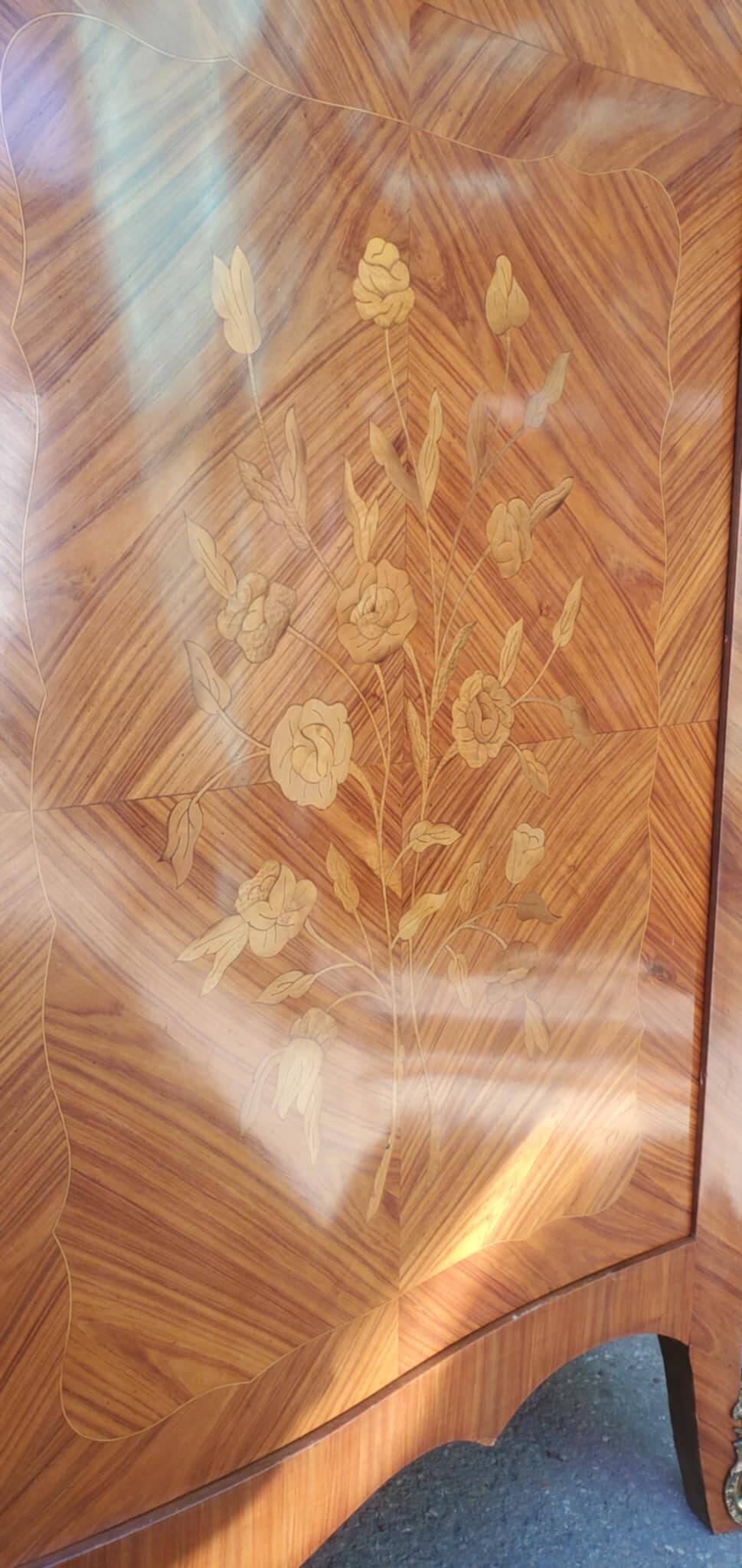Two-door cabinet with marquetry floral design from the early 20th century.