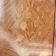 Two-door cabinet with marquetry floral design from the early 20th century.