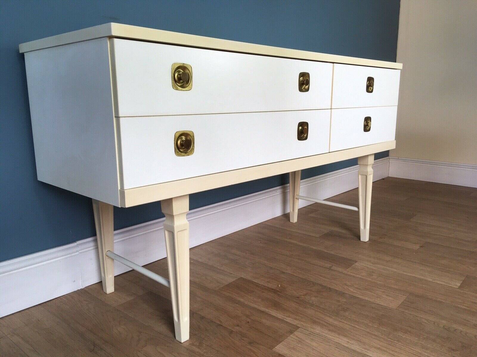 White retro wooden commode in Mid-Century style, tapered legs and gold handles (1960s)
