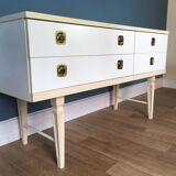 White retro wooden commode in Mid-Century style, tapered legs and gold handles (1960s)