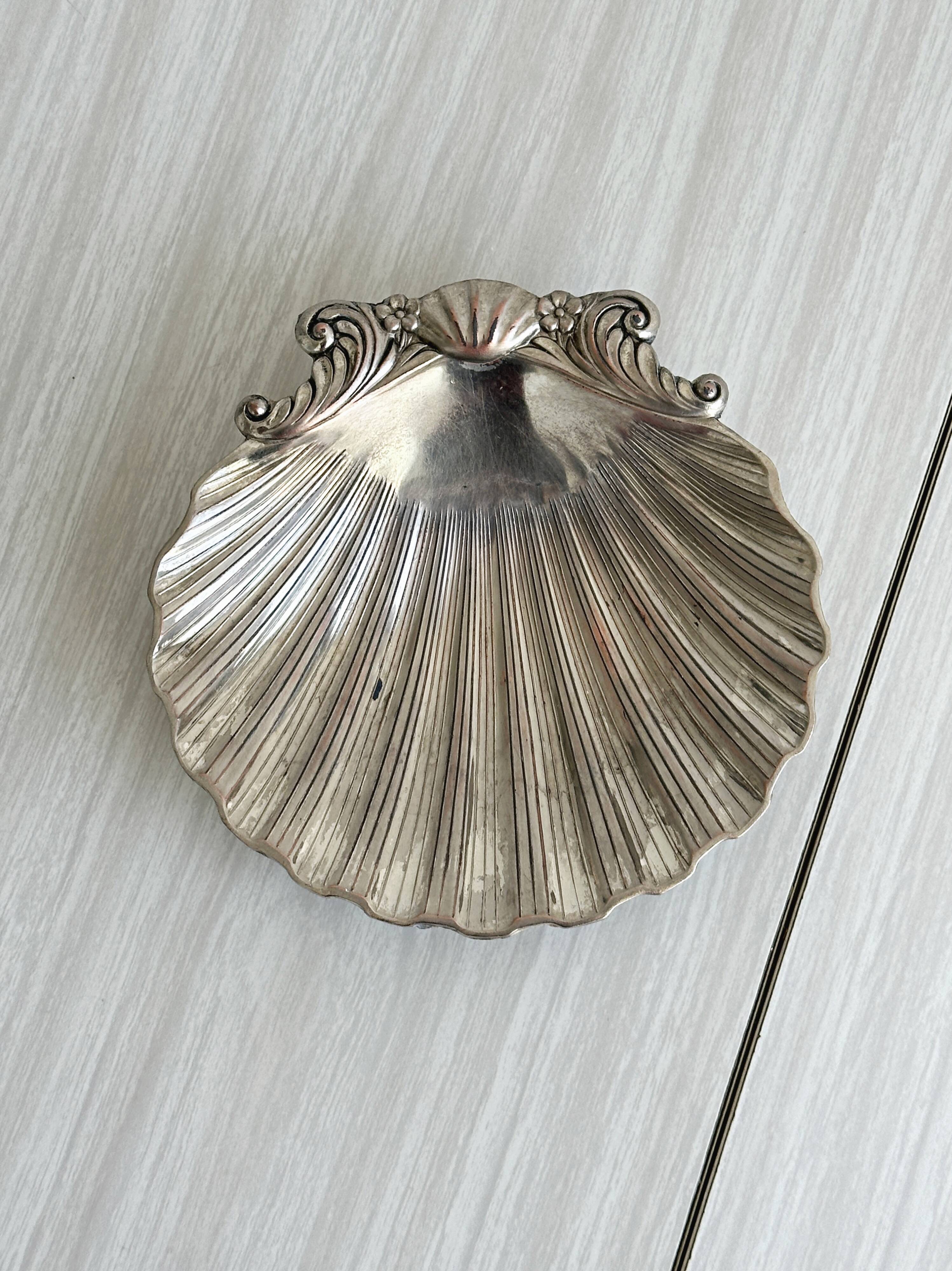 shell-shaped metal pocket tray with patina