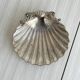 shell-shaped metal pocket tray with patina