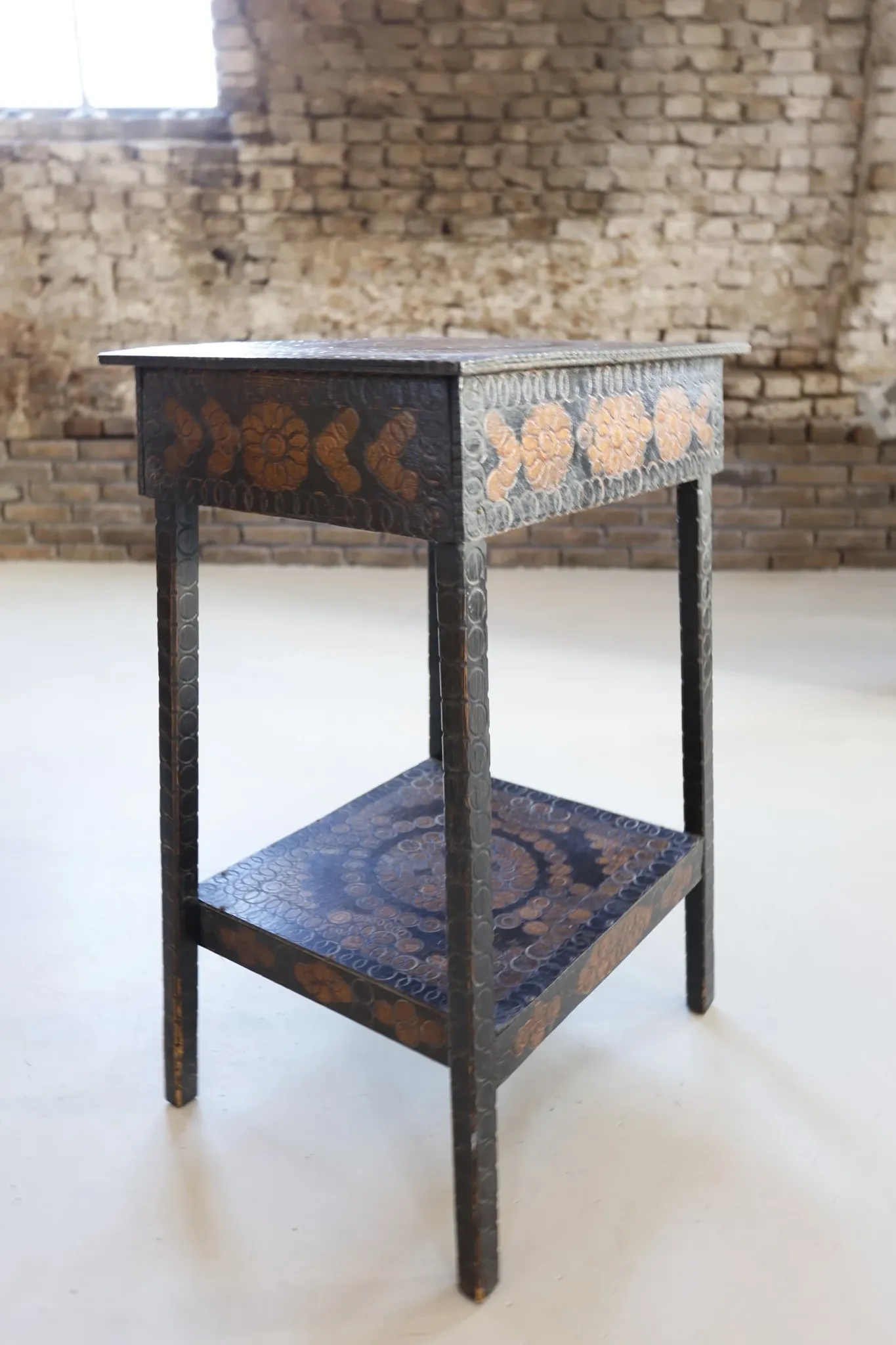 Decorated antique side table with elephant