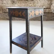 Decorated antique side table with elephant