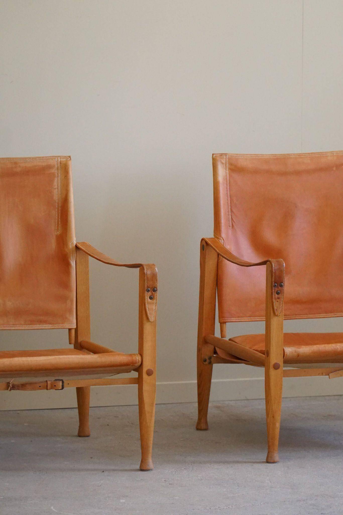 Kaare Klint, a pair of Safari chairs in ash and leather, Rud. Rasmussen, 1960s.