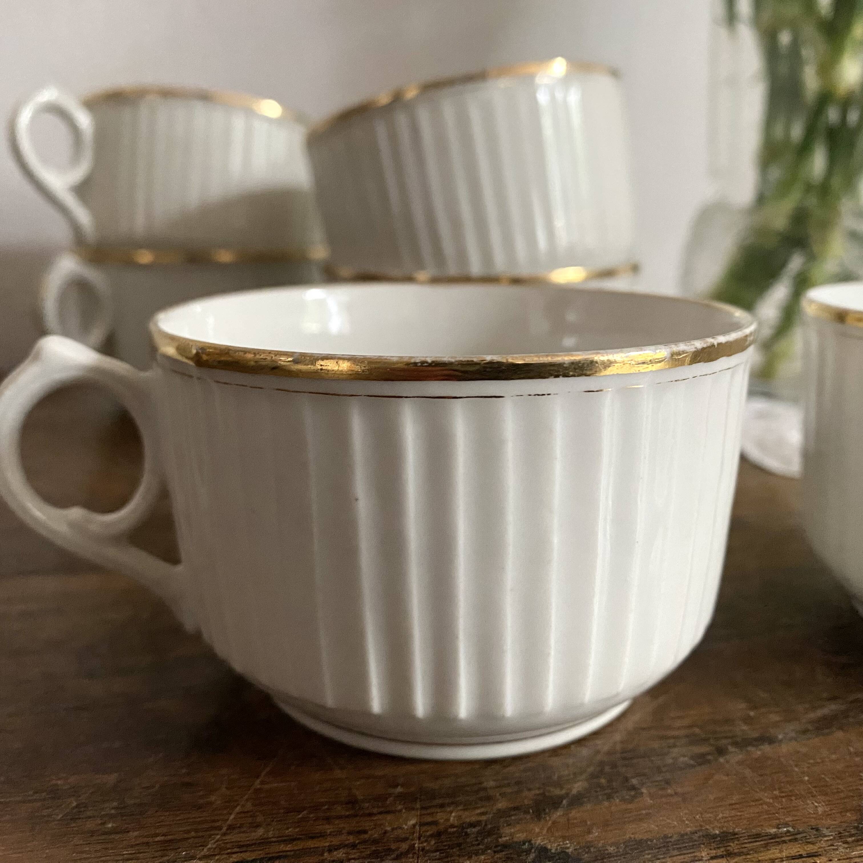 White and gold porcelain cups
