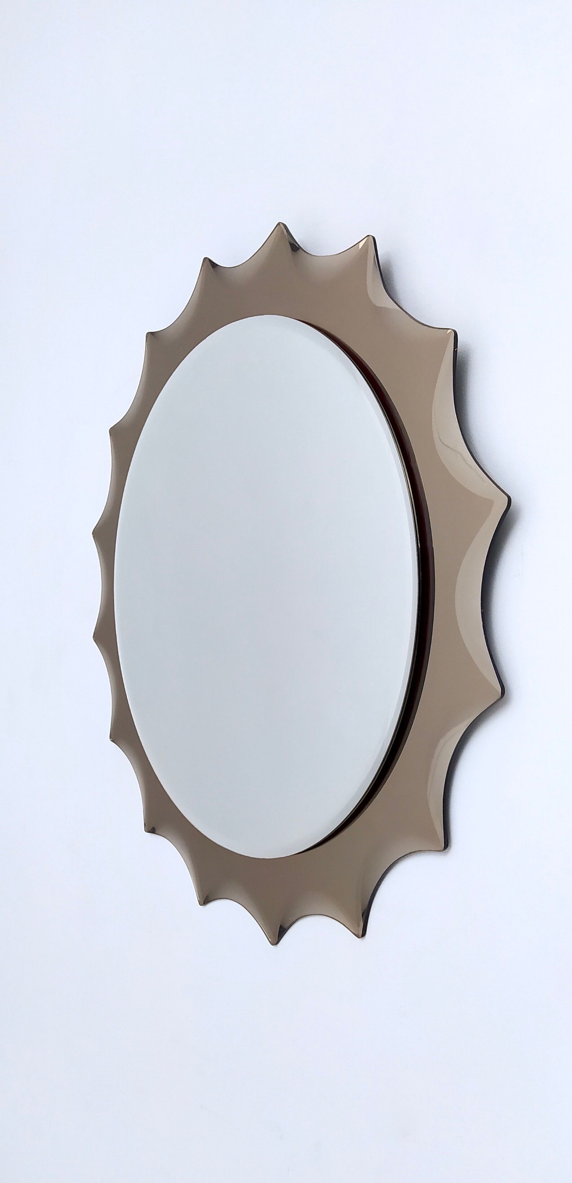Postmodern sun shaped bronze wall mirror, italy