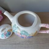 Old ceramic teapot in the shape of a basket of fruits from the garden