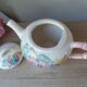 Old ceramic teapot in the shape of a basket of fruits from the garden