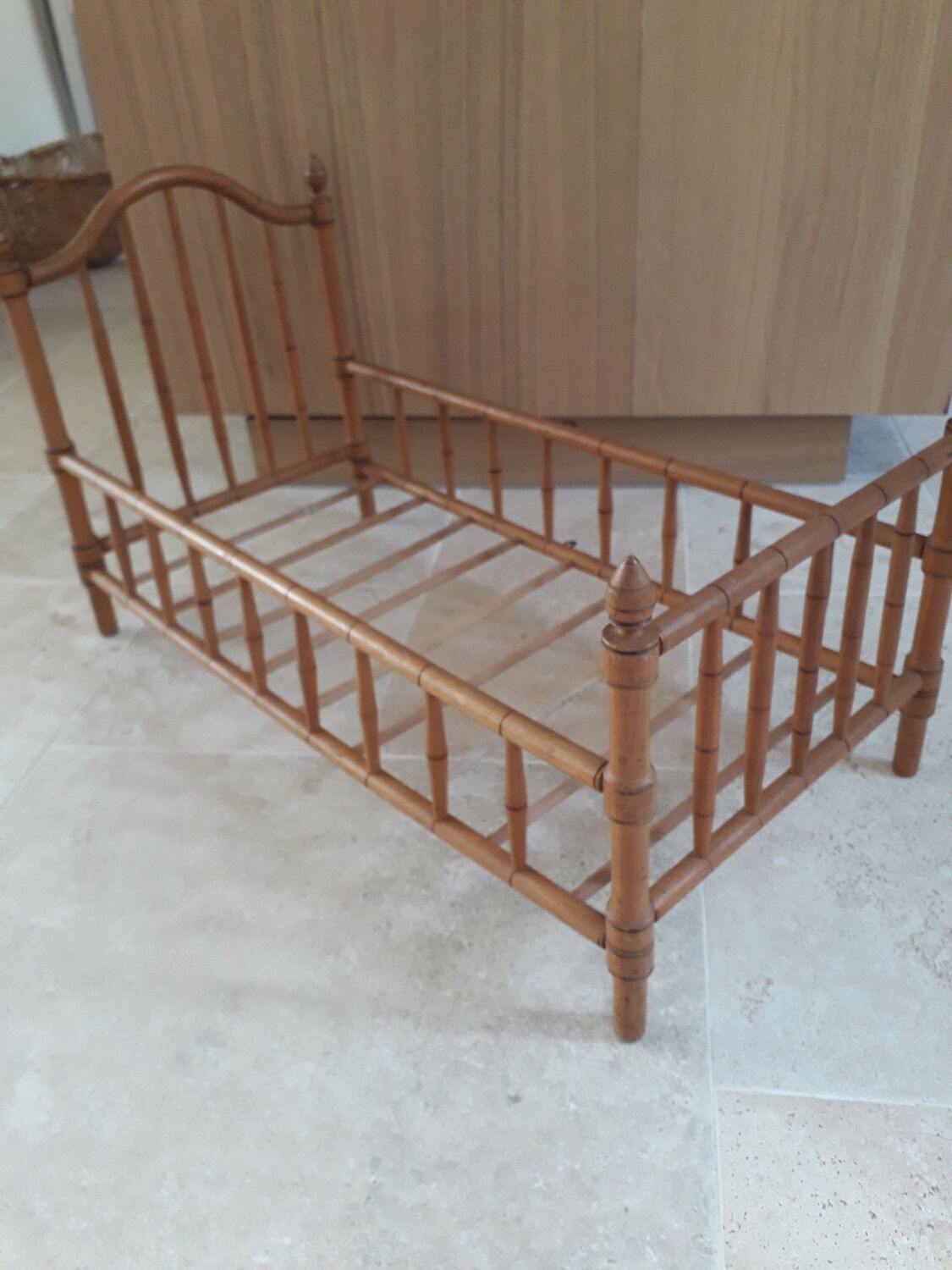 Old wooden doll's bed