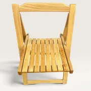 Blonde wooden folding chair in the style of Aldo Jacober.