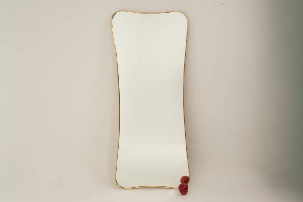 Golden brass mirror in the style of Gio Ponti. 1980s or 1990s.