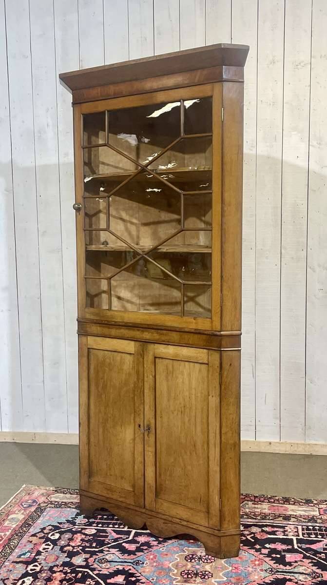 19th-century English corner cabinet in oak, mahogany, and fir.