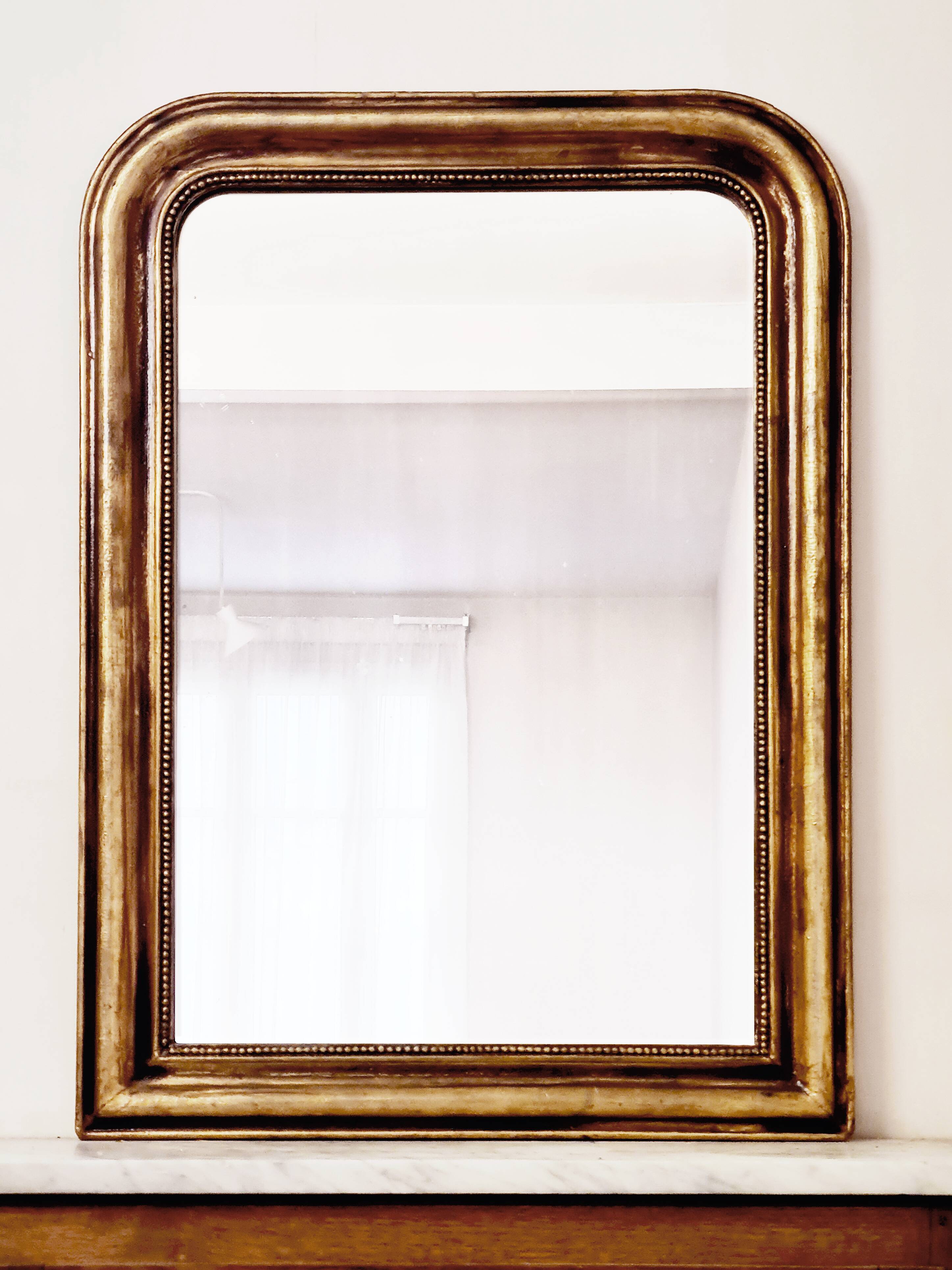Antique Louis-Philippe gilded mirror “Apoline”