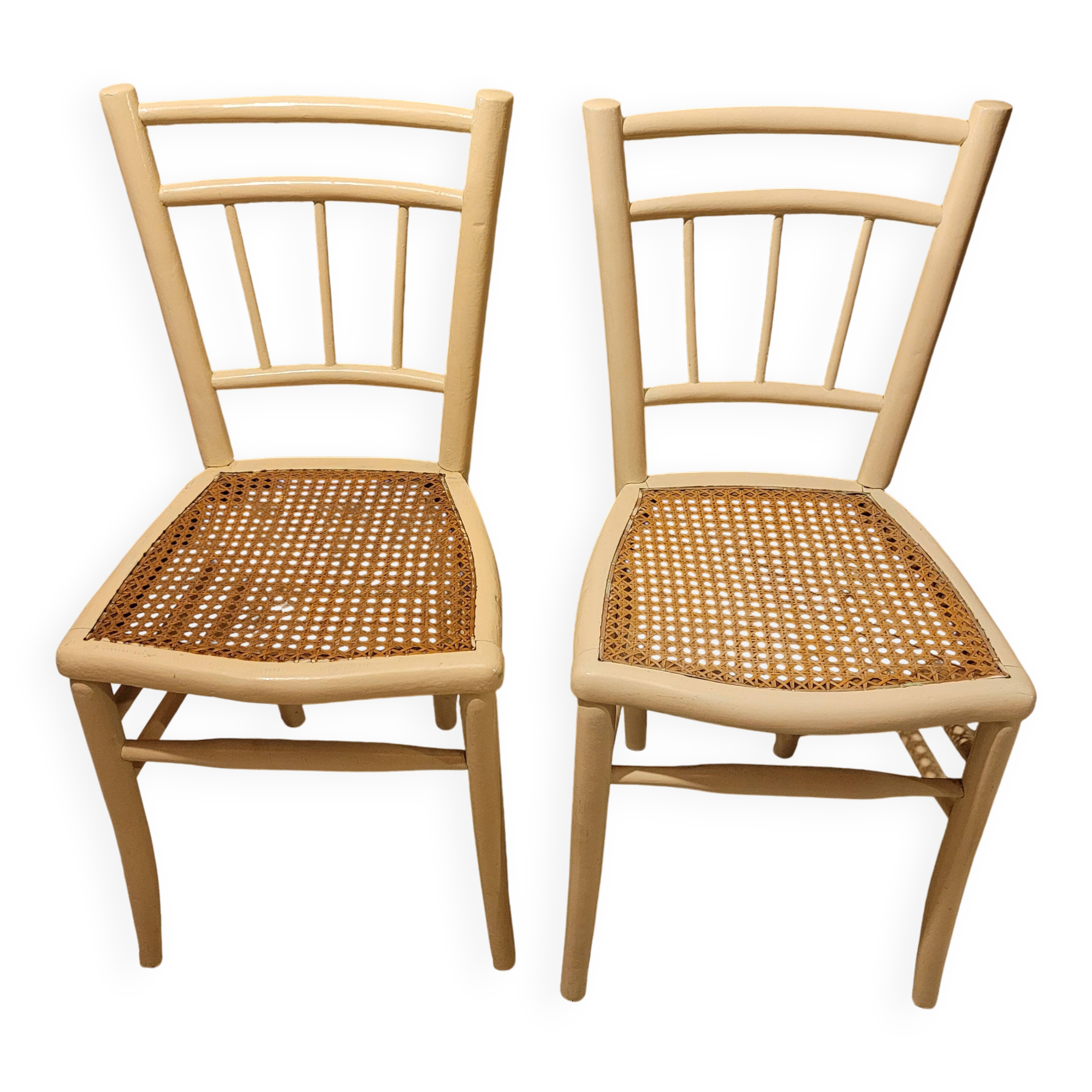 2 white wooden chairs