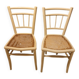 2 white wooden chairs