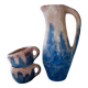 Set of artisanal pitcher and weathered cups