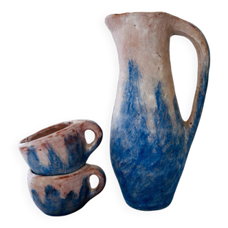 Set of artisanal pitcher and weathered cups