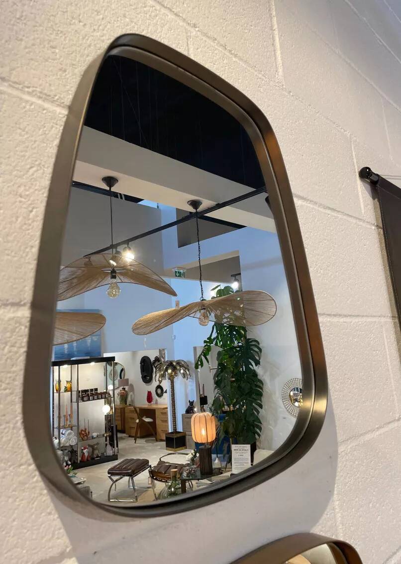 Rearview mirror and free-form brushed metal contour