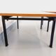 Suite of two vintage modernist Isa coffee tables in teak and black metal from the 60s