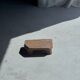 Small stool, teak footrest with short cut corners.