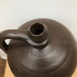 Ancient varnished sandstone jug