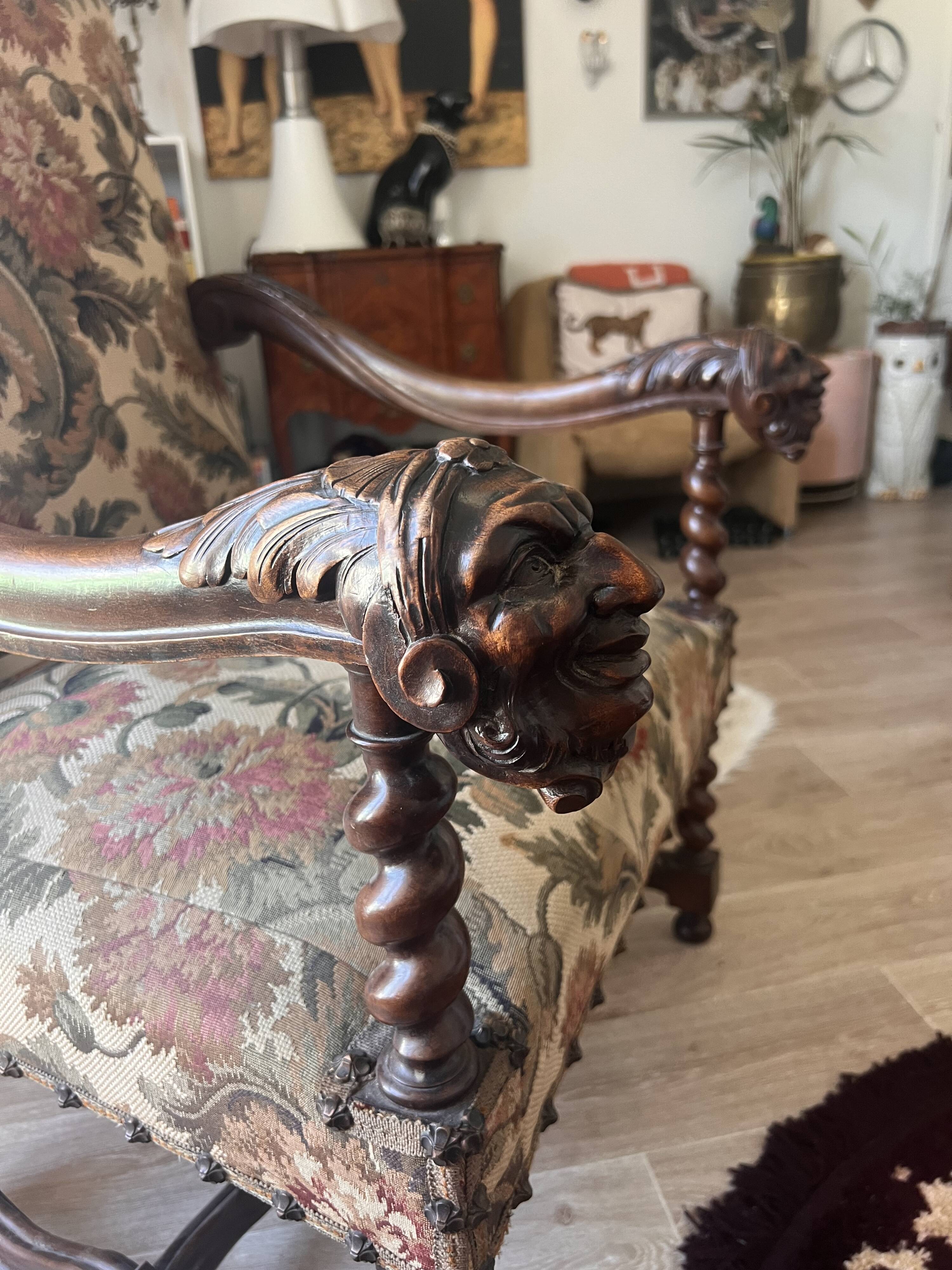 Antique armchair in Henri II style with masks