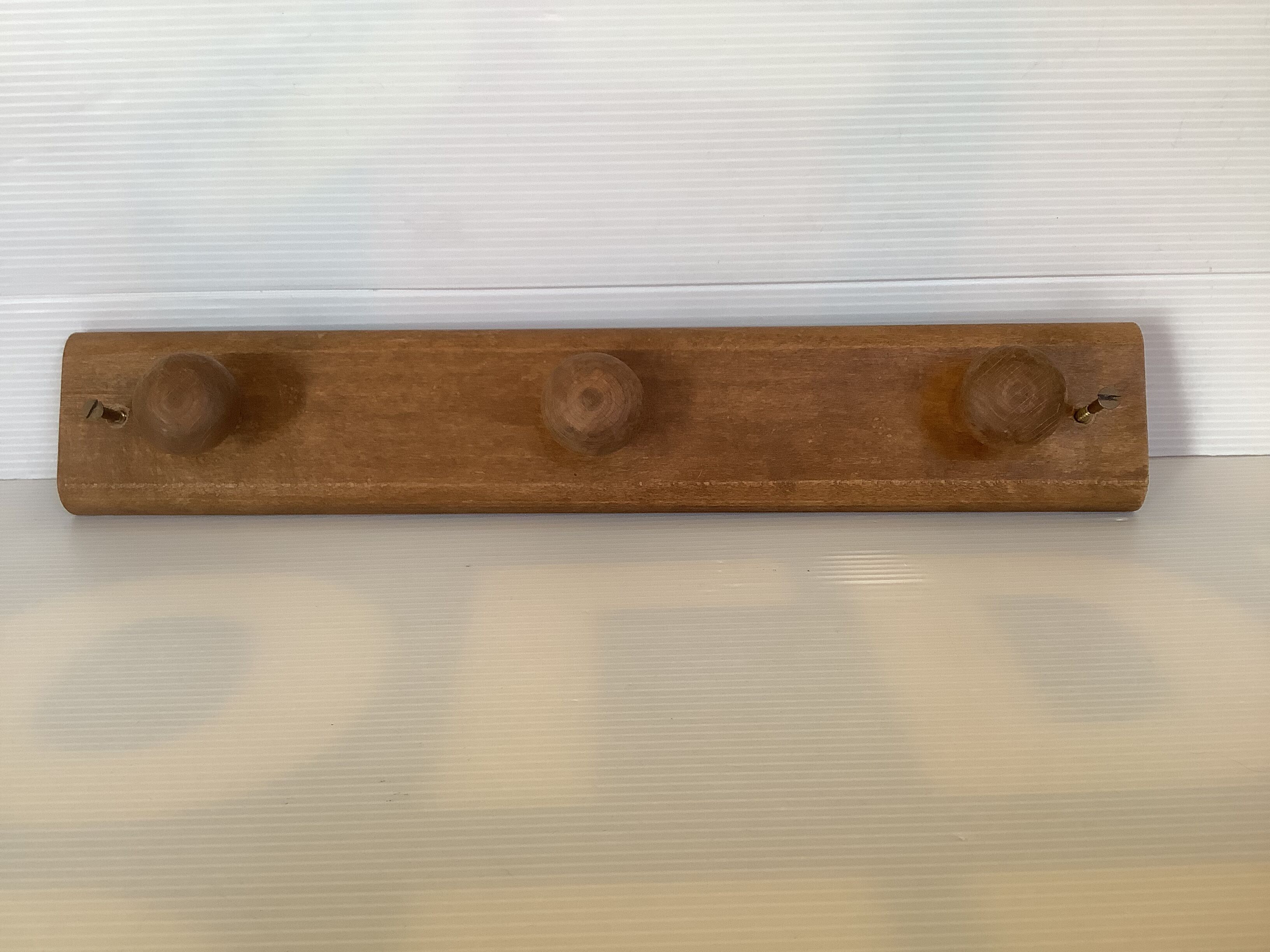 Wooden wall coat rack