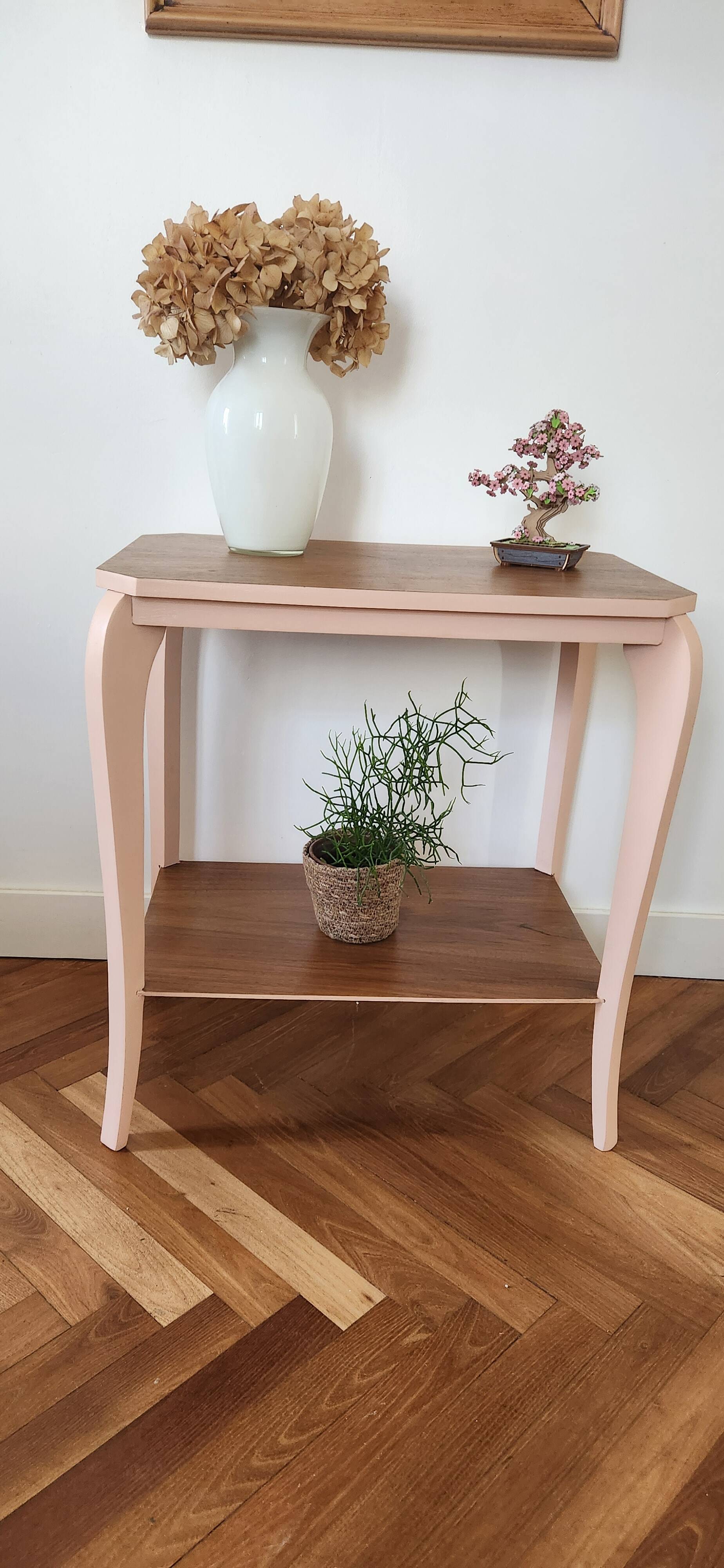 Side table with curved pink legs