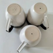 Set of three two-tone mugs, glazed stoneware, café workshop style.