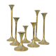 Seven candle holders in golden brass vintage trend