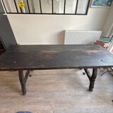 Solid wood farmhouse table with ebony finish.