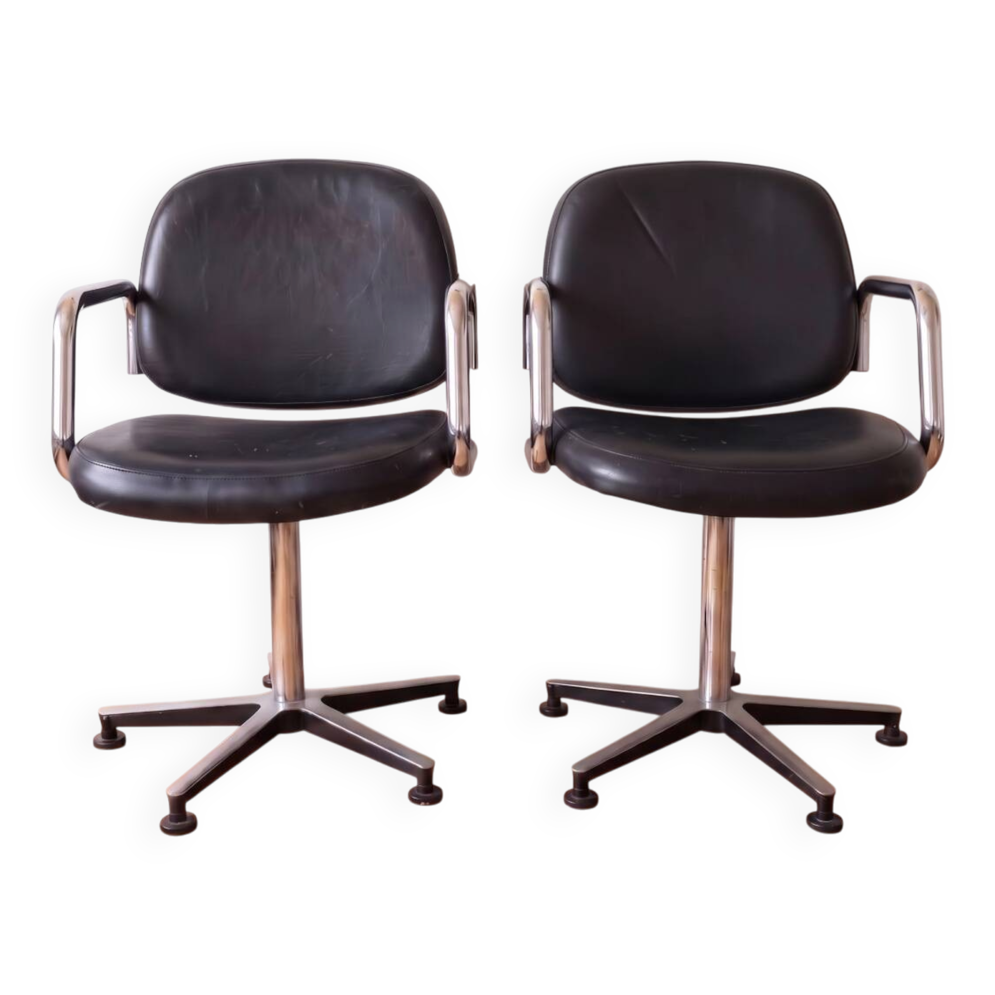 Pair of vintage swivel armchairs in metal and black faux leather.