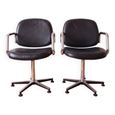 Pair of vintage swivel armchairs in metal and black faux leather.